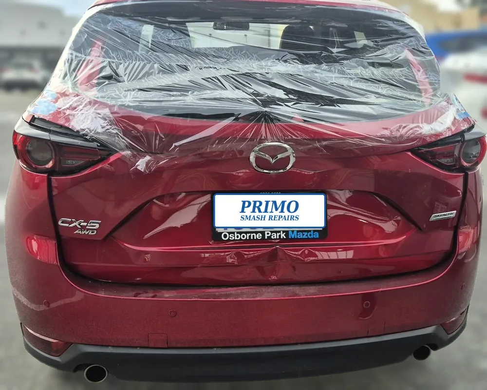 Red Mazda CX-5 before repair